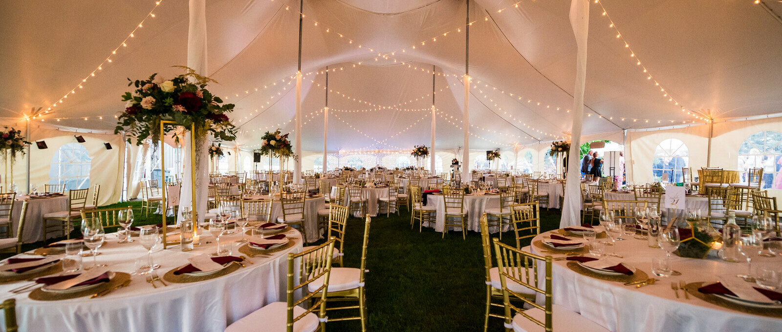 Special Event Rentals - Red Deer showcases an event reception with round tables, walnut folding chairs, and dance floor under a big pole tent
