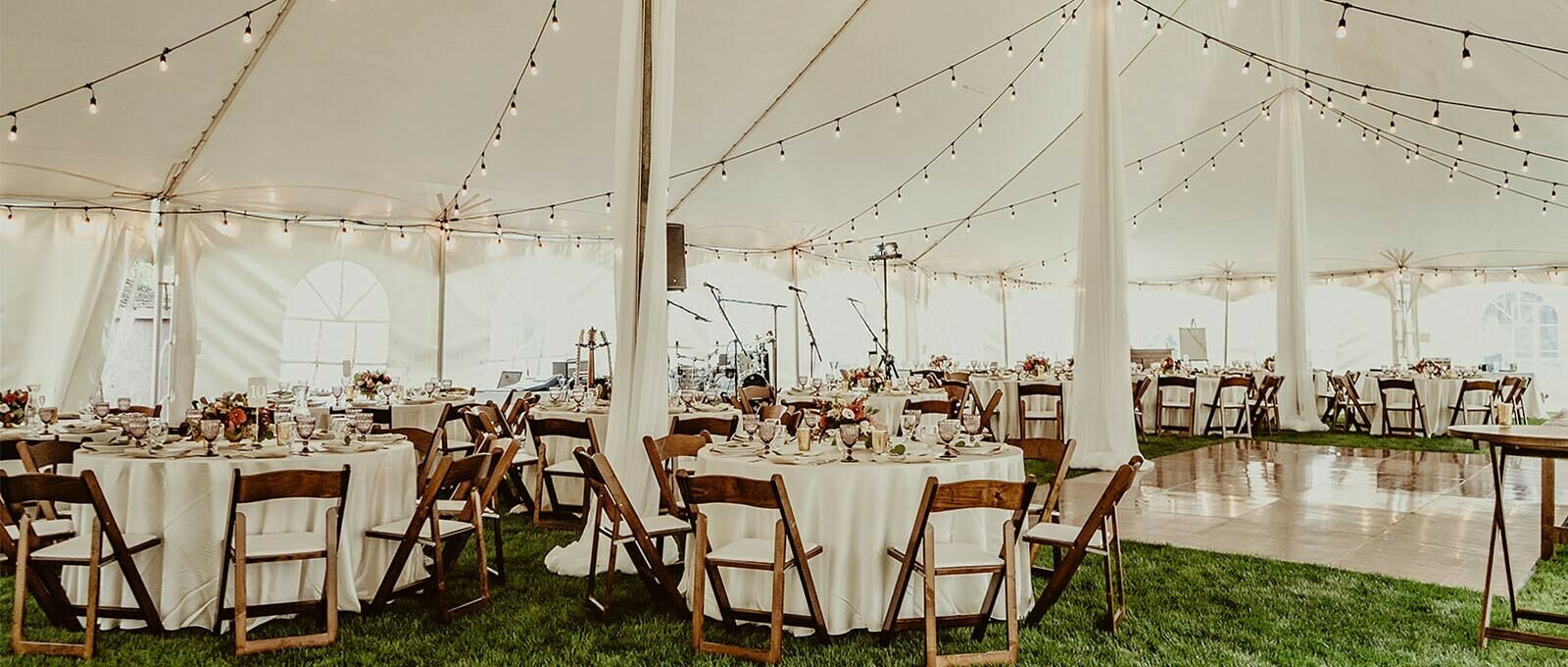 Special Event Rentals - Red Deer showcases an event reception with round tables, walnut folding chairs, and dance floor under a big pole tent
