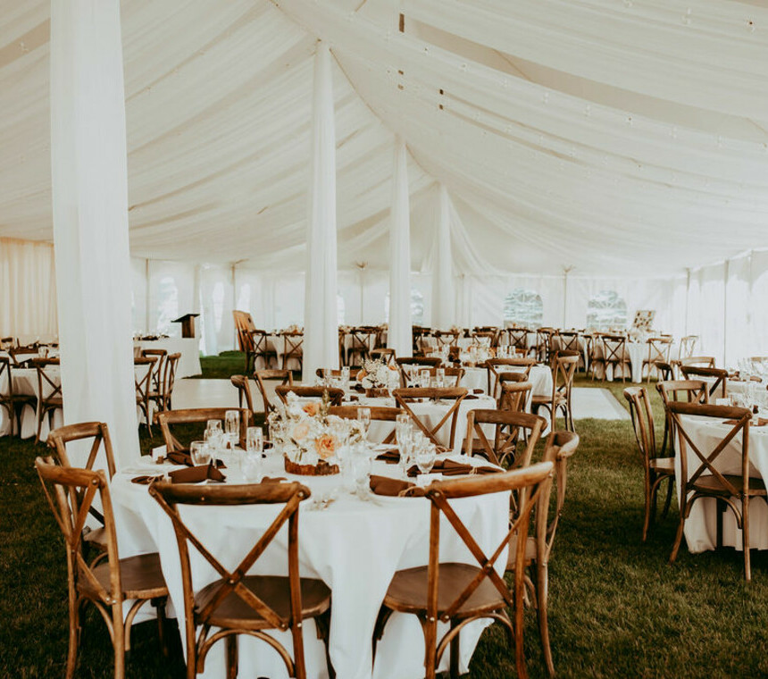 Wedding reception venue set up by Special Event Rentals outside under a tent
